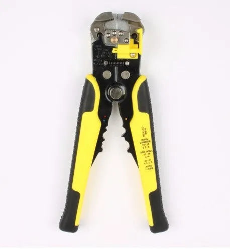 Yellow automatic 3-in-1 wire stripper, crimper, and cutter tool on a workbench.