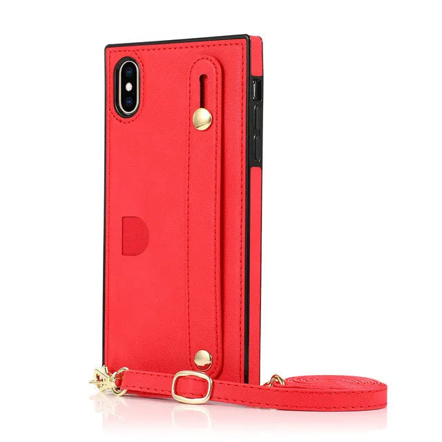 Black leather iPhone case with card holder slot and adjustable wristband holster attached.