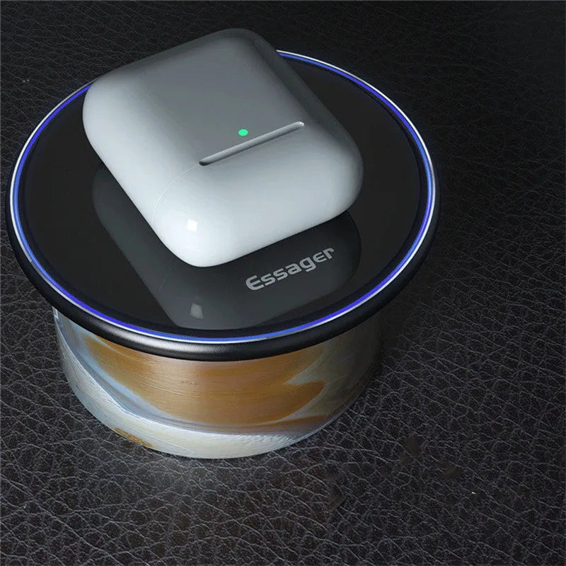 Black or white aluminium wireless charging pad showing soft LED light, for phones and headphones.