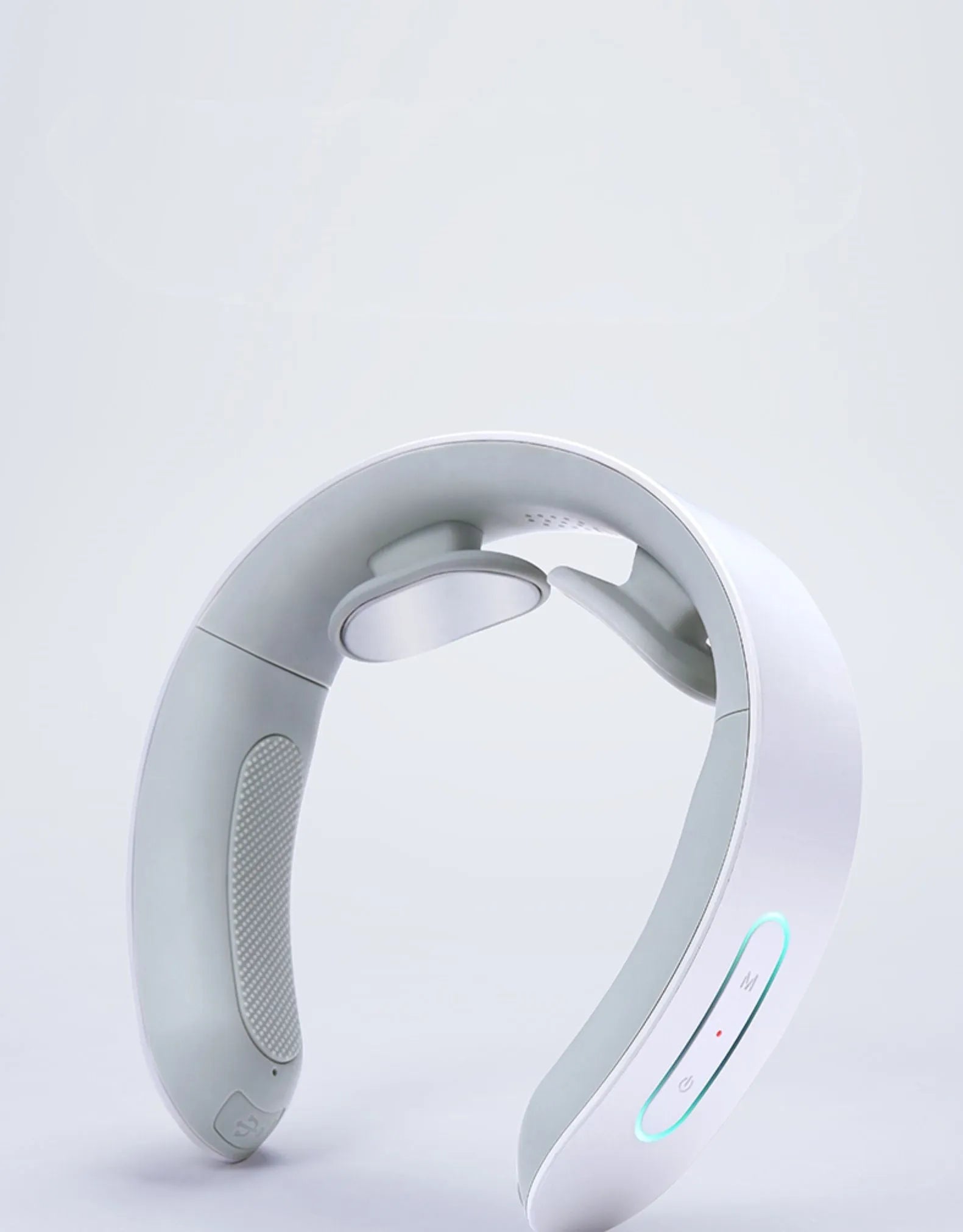 White electric acupressure massager device for back, neck and shoulder pain relief.