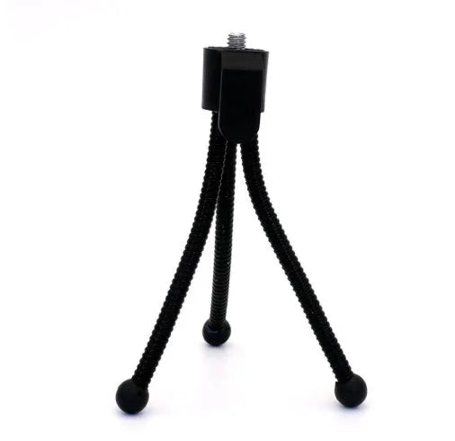 Compact black iron frame mini desktop tripod with a ball head, shown folded and extended next to a smartphone.