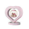 Pink preserved rose decorative ornament with optional Bluetooth-enabled base for playing music
