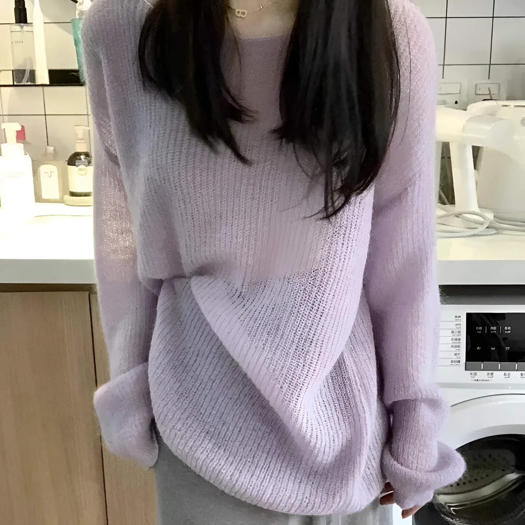 Purple women's blouse with hollow out pattern and princess sleeves on mannequin