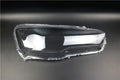 Transparent plastic headlight housing cover for vehicle replacement measuring 50x30x20mm