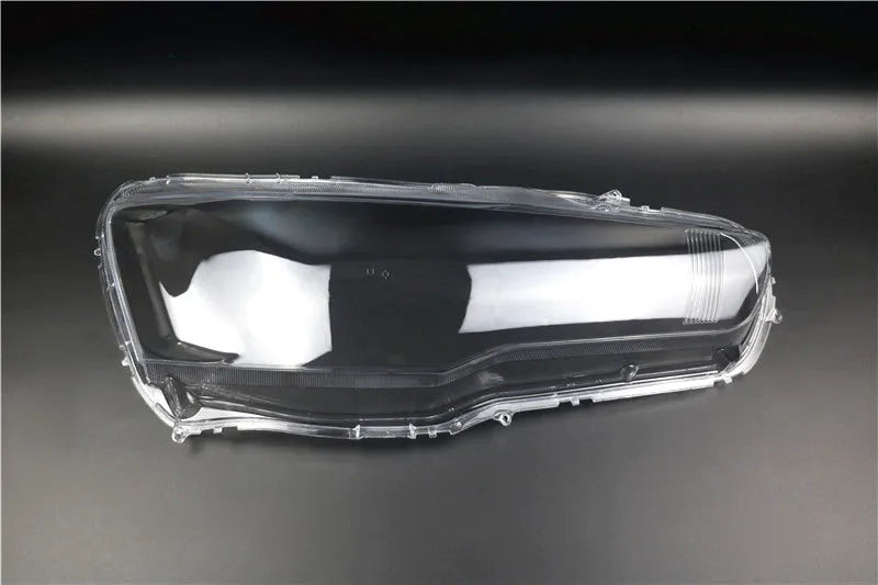 Transparent plastic headlight housing cover for vehicle replacement measuring 50x30x20mm