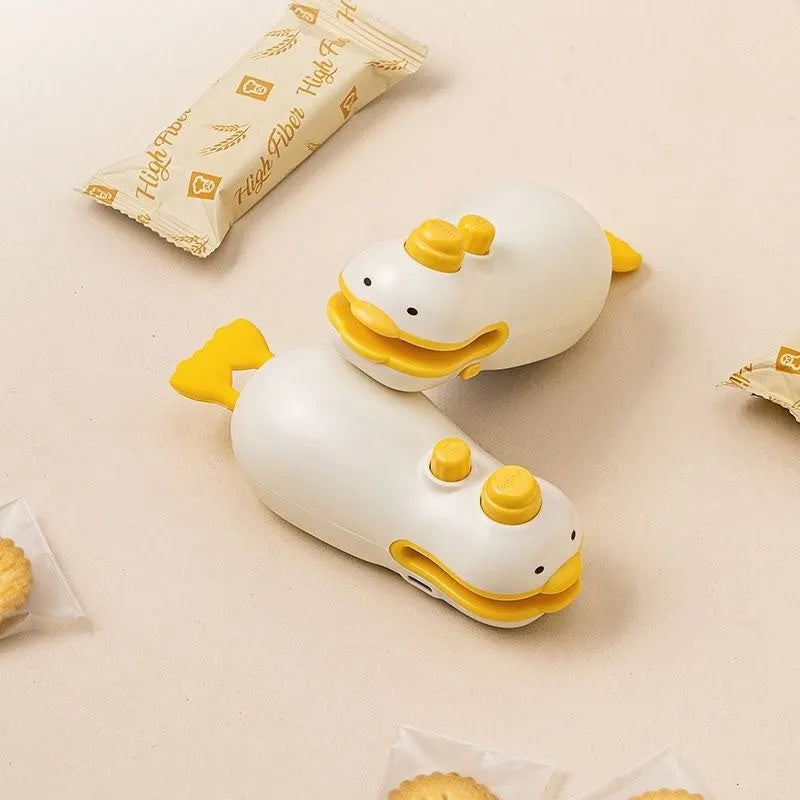 Yellow duck-shaped rechargeable handheld heat sealing machine with USB charging cable