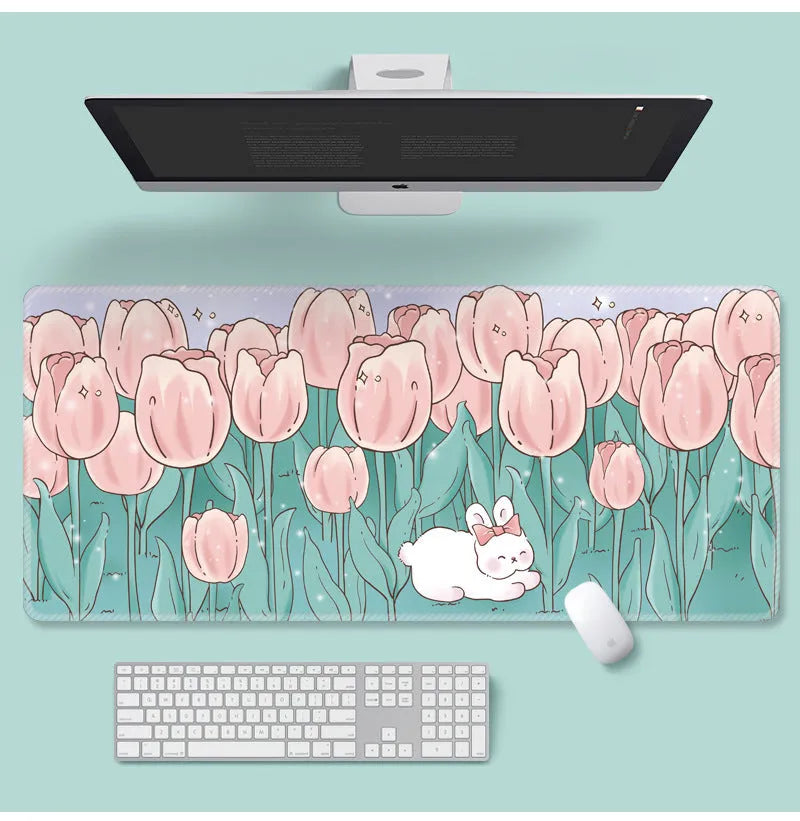 Large floral pattern mouse pad on a desk with keyboard and mouse, showing non-slip rubber base.