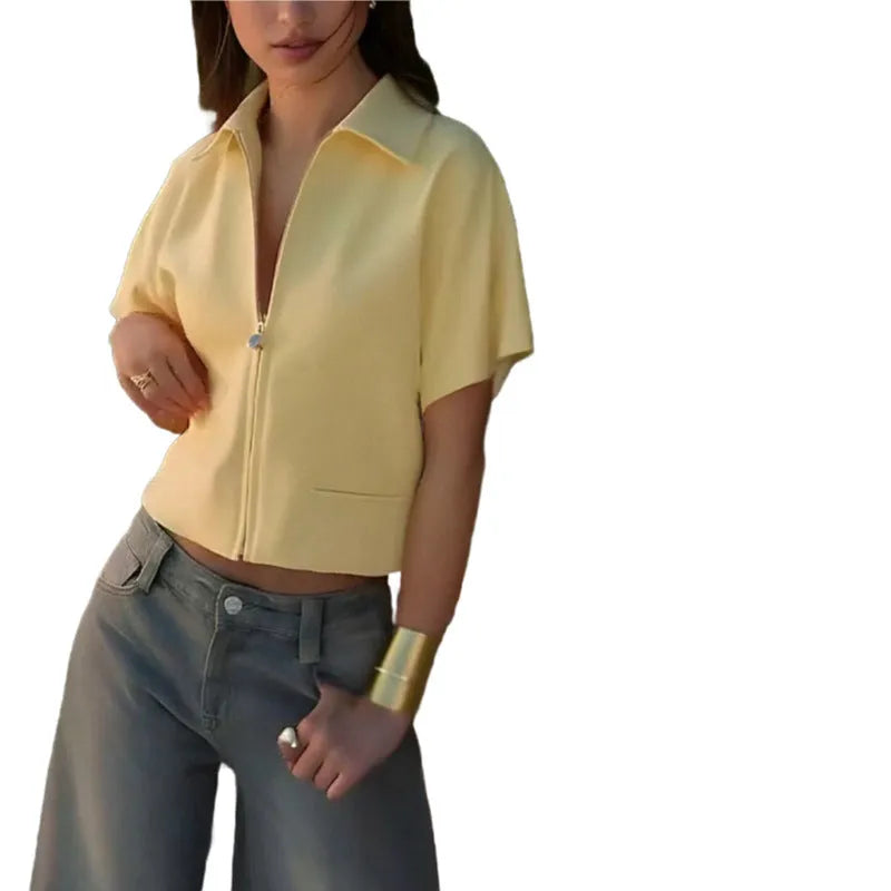Loose fit casual polyester top in yellow on a hanger