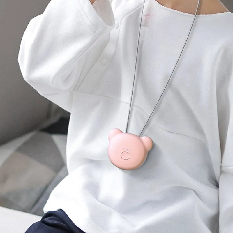 Mini USB portable air purifier necklace worn as a collar, showing pink and blue colour options.