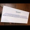 Apple white Bluetooth wireless keyboard with metal construction and multimedia keys