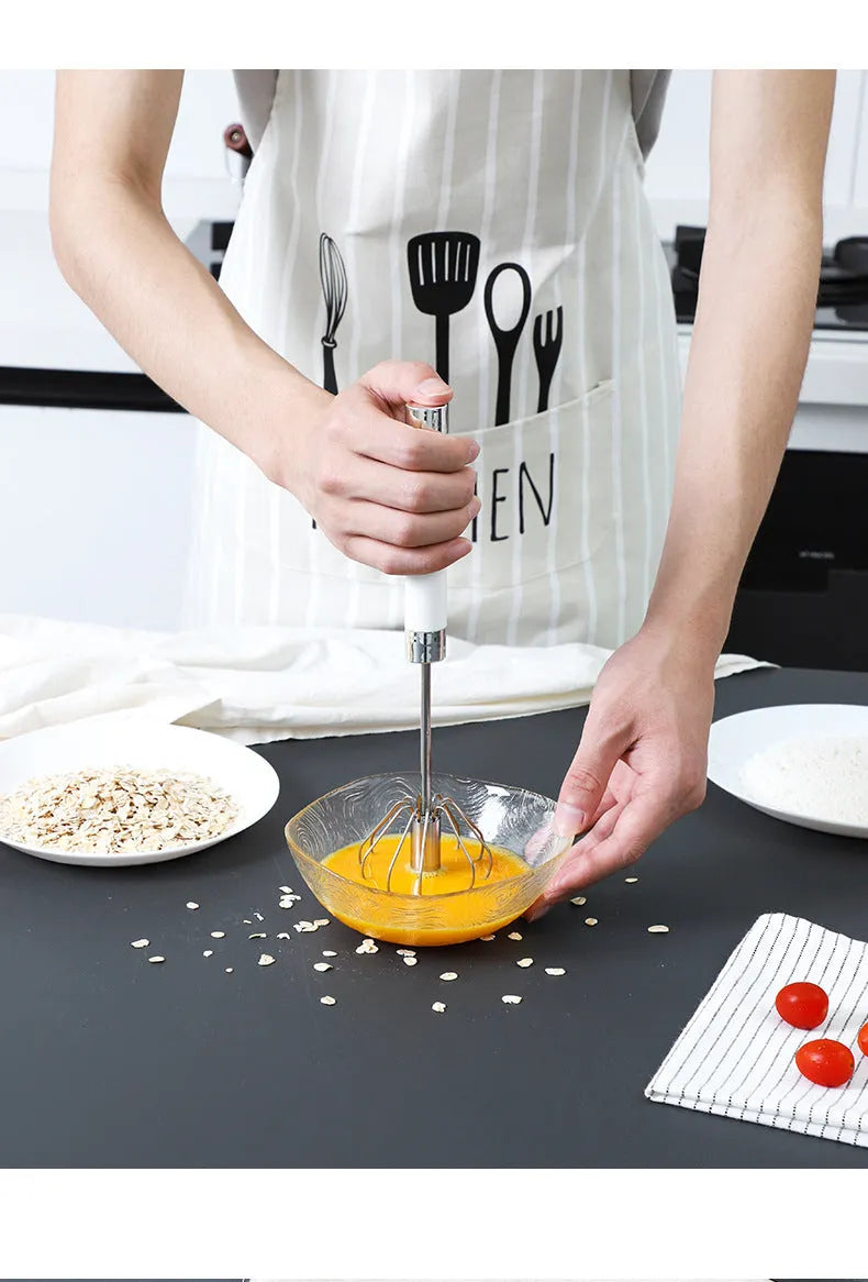 Semi-automatic manual egg beater whisk in stainless steel and white plastic