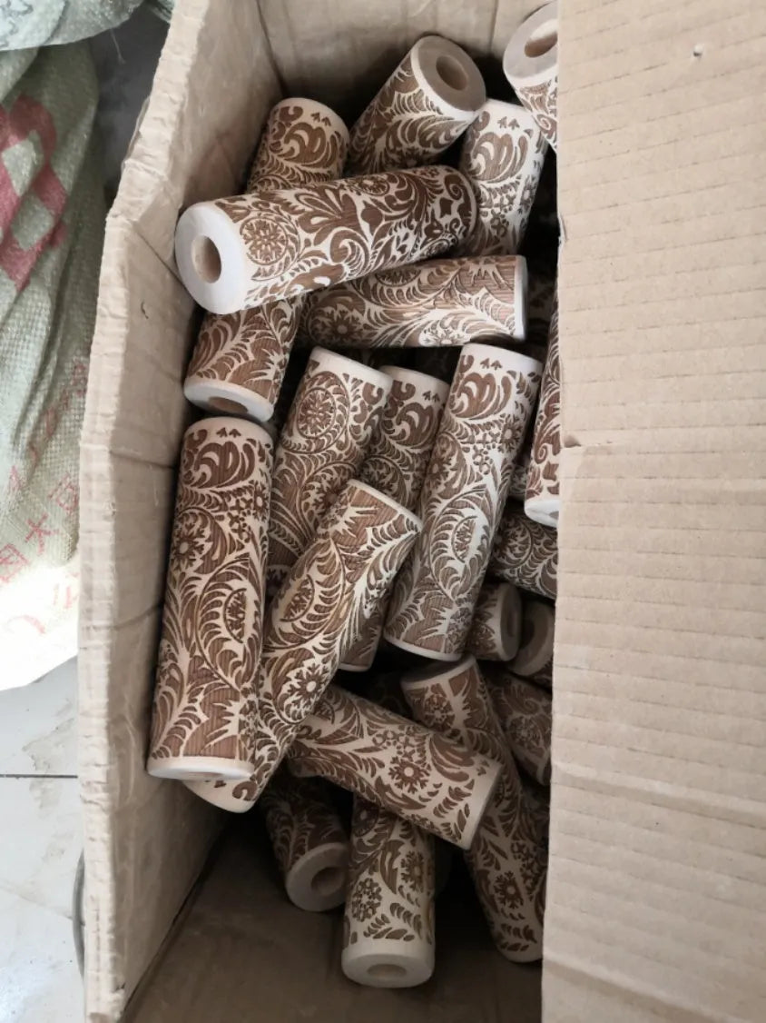 Wooden rolling pin with embossed Christmas pattern, measuring 45cm long.