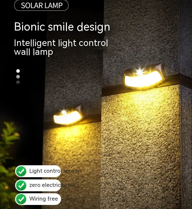 Solar outdoor wall light with smiling face design and IP65 waterproof rating