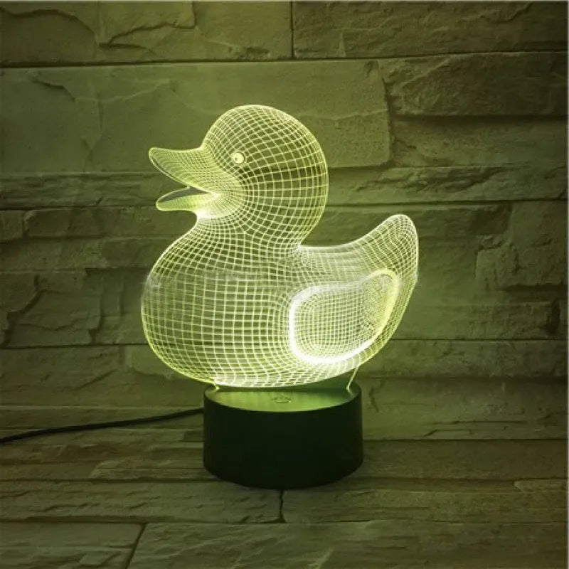 Yellow duck cartoon 3D night light table lamp with remote control on a table.
