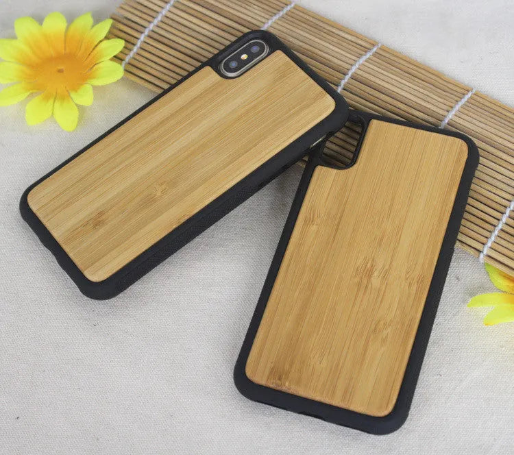 Wooden iPhone case with carbonised bamboo back and black TPU bumper on an iPhone.