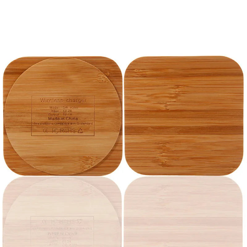 Brown wooden bamboo square 5W wireless charging pad on a desk.