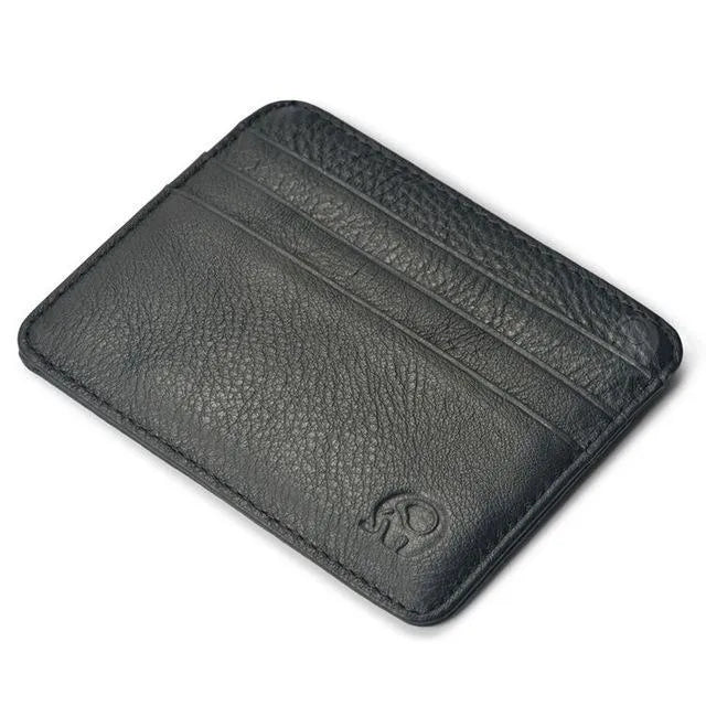 Genuine leather magic wallet in brown, open to show 27 card slots, money clip, and ID window