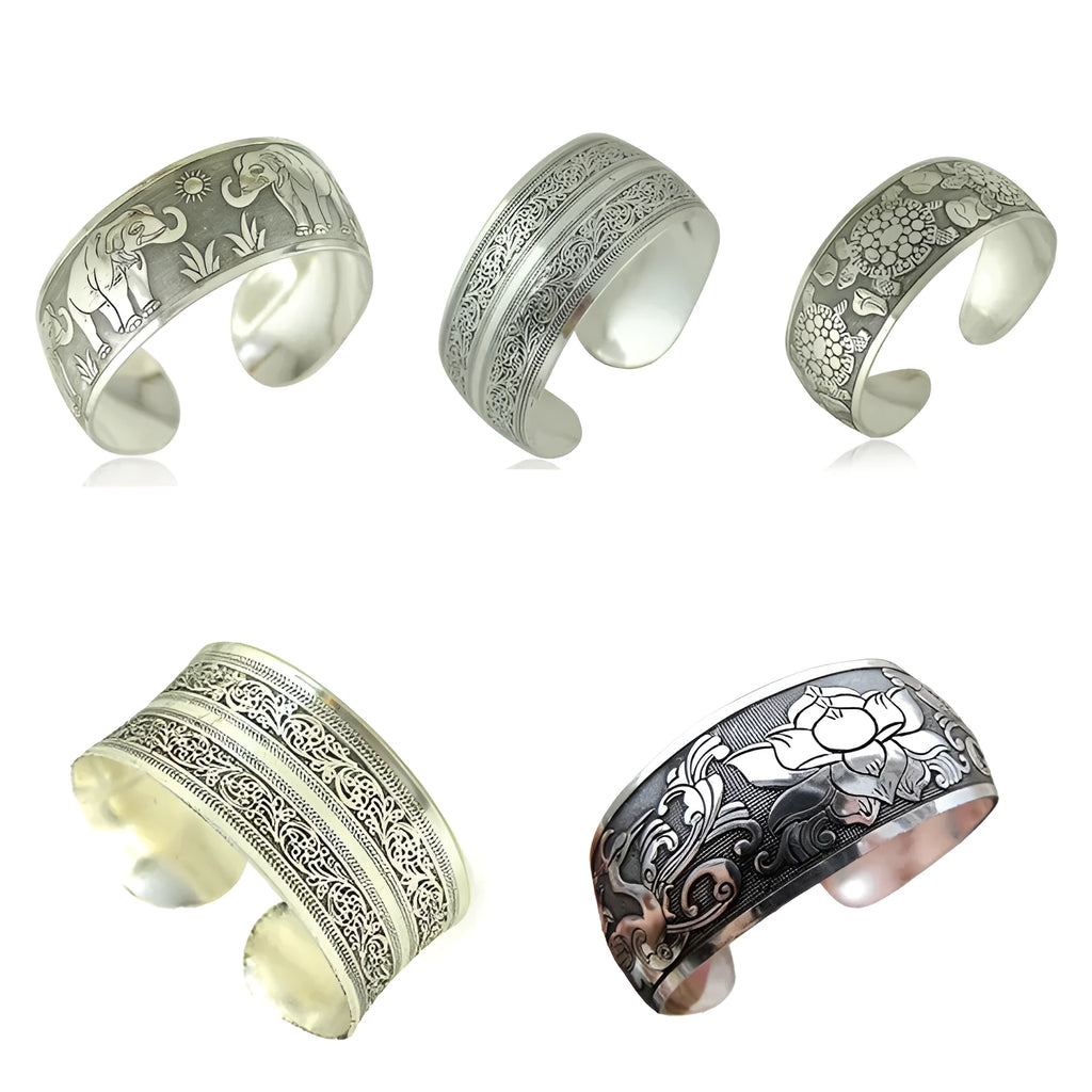 Silver Miao ethnic carved openwork Roman bracelet with elephant motif on alloy material