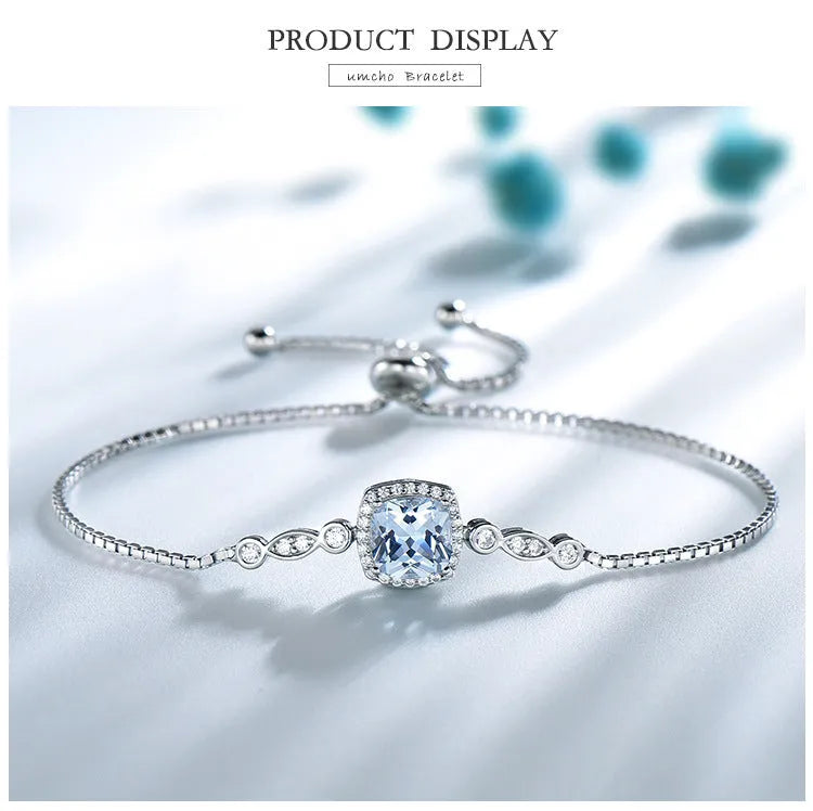 925 sterling silver jewellery set with sky blue topaz stones, including necklace, bracelet and earrings