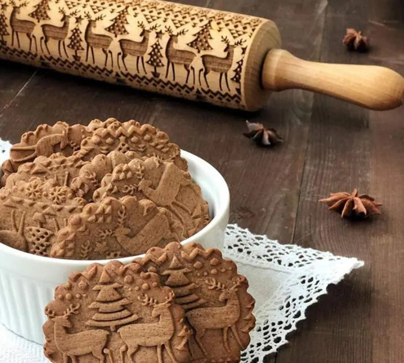 Wooden rolling pin with embossed Christmas pattern, measuring 45cm long.