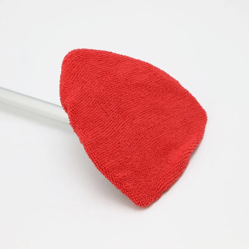 A plastic car windscreen cleaning brush with a long handle, shown in red, green, and blue colour options.