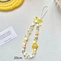 Yellow beaded flower mobile phone lanyard with hand rope design on wrist