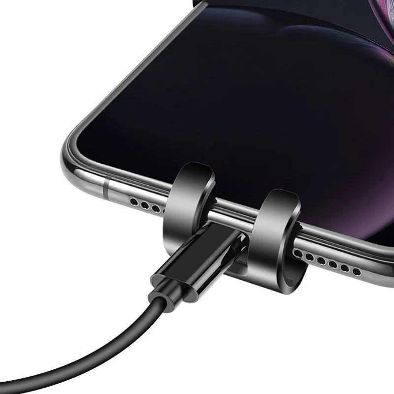 Black S4 gravity mirror ABS car phone holder attached to a vehicle's air conditioning vent.