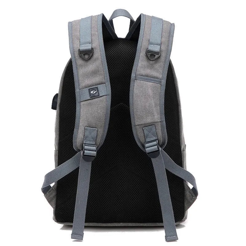 Canvas shoulder backpack with USB charging port in coffee colour showing computer pocket and main compartment