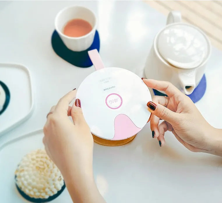 Portable UV baby bottle steriliser in blue or pink, showing compact size and USB port.