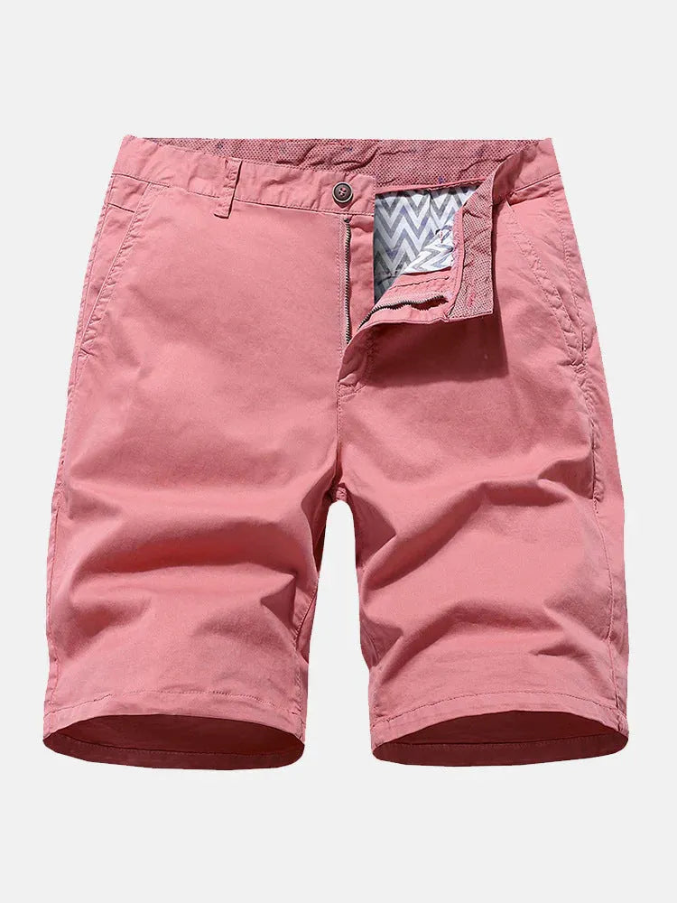 Man wearing blue denim casual shorts with no belt, straight leg, and loose workwear fit