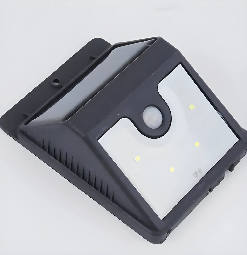 Solar outdoor LED sensor lights with four circular solar panels for automatic garden and pathway illumination