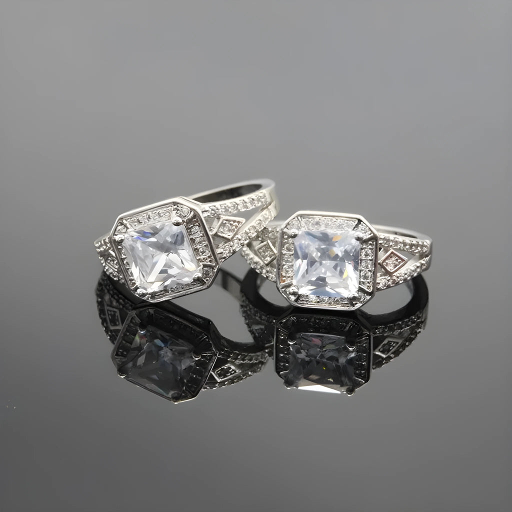Geometric hollow zircon ring in platinum colour with four-sided design on woman's finger