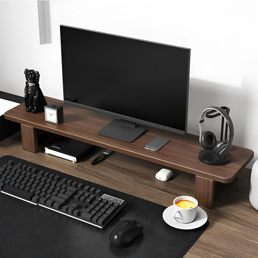 Solid walnut wood computer monitor heightening frame on a wooden desk with a keyboard stored below