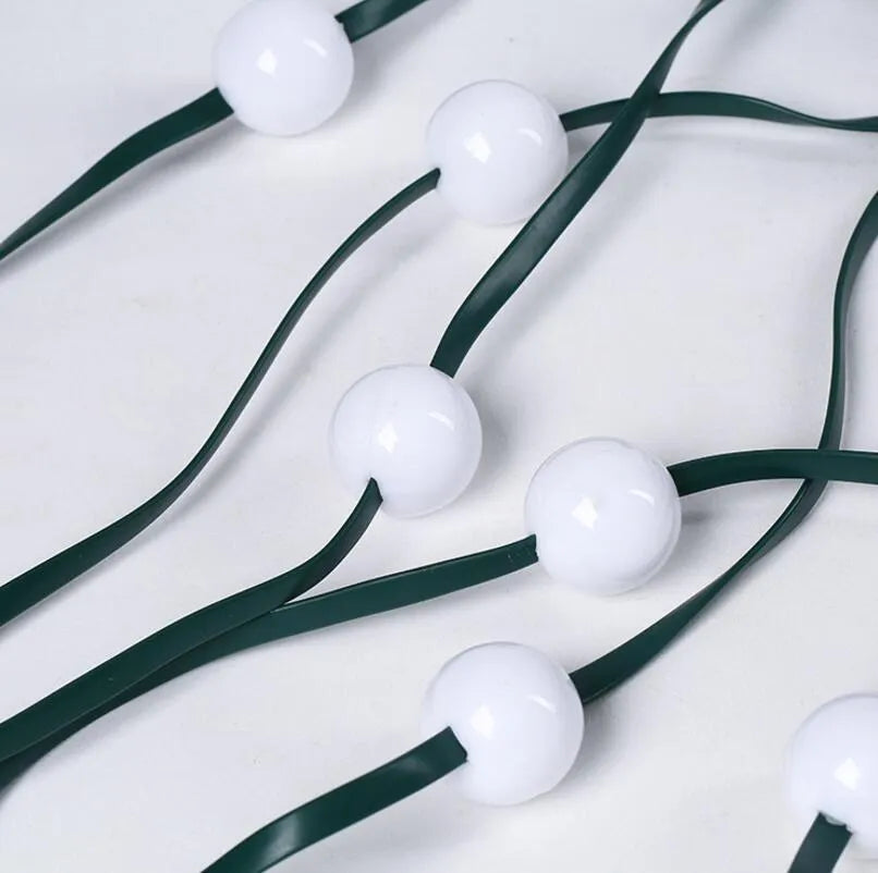 64 LED dazzler shower tree light string on a Christmas tree showing cascading lights with IP44 outdoor rating