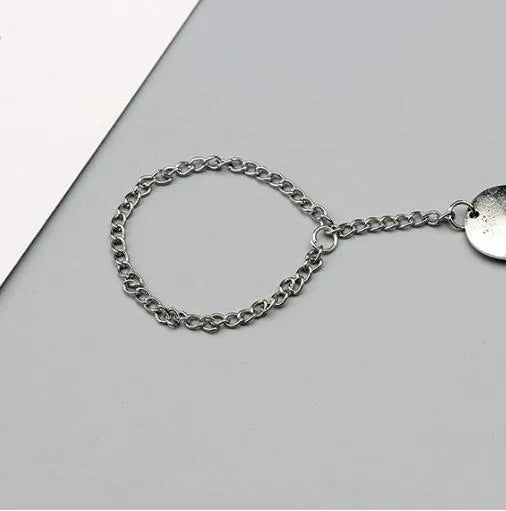 Antique silver hollow flower chain anklet with teardrop shape on a surface, 24cm foot jewellery for women