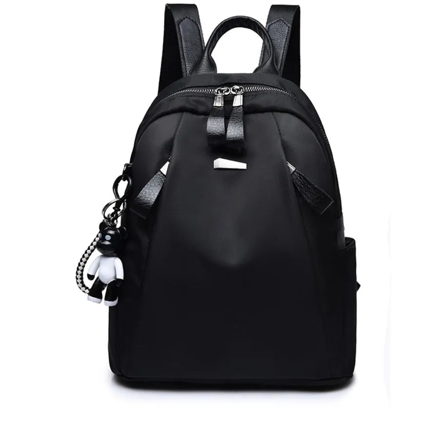 Medium-sized grey Oxford cloth rucksack with double straps, shown open to reveal internal phone and ID pockets.