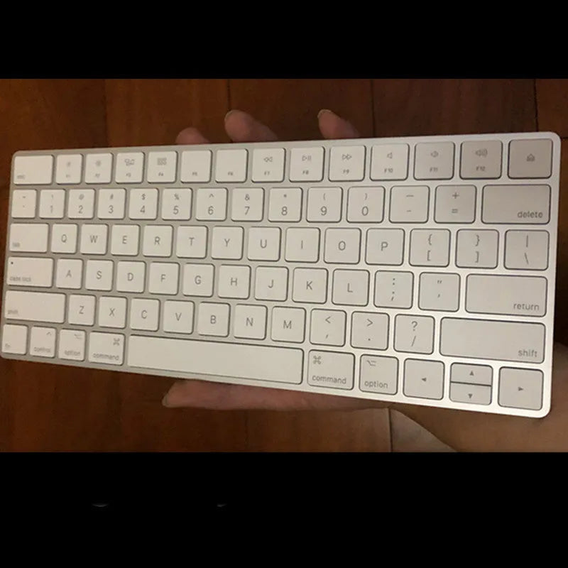 Apple white Bluetooth wireless keyboard with metal construction and multimedia keys