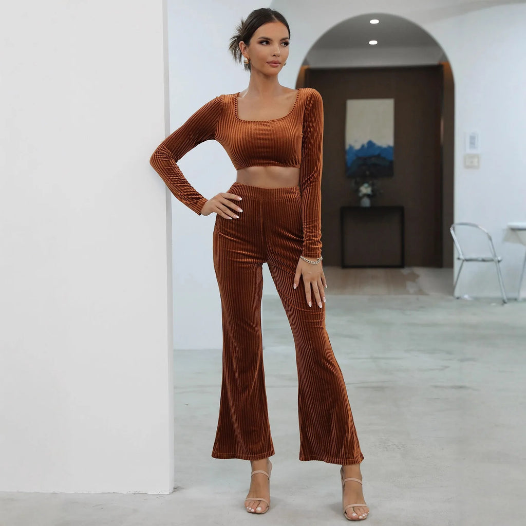 Caramel coloured women's long sleeve sweater and loose trouser co-ord set on a hanger