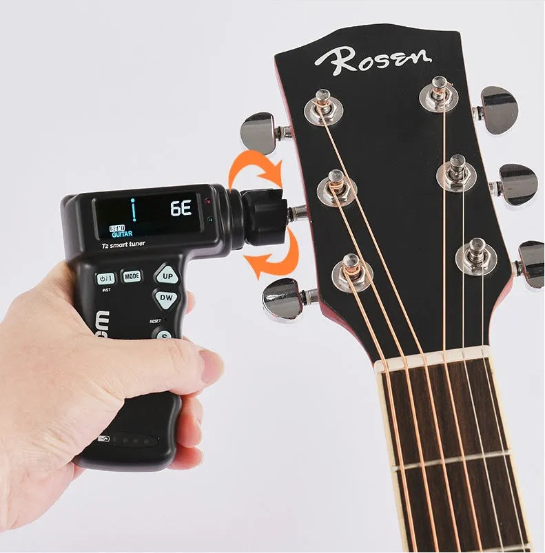 Black and white smart guitar tuner and string winder combo with LCD display and USB charging cable