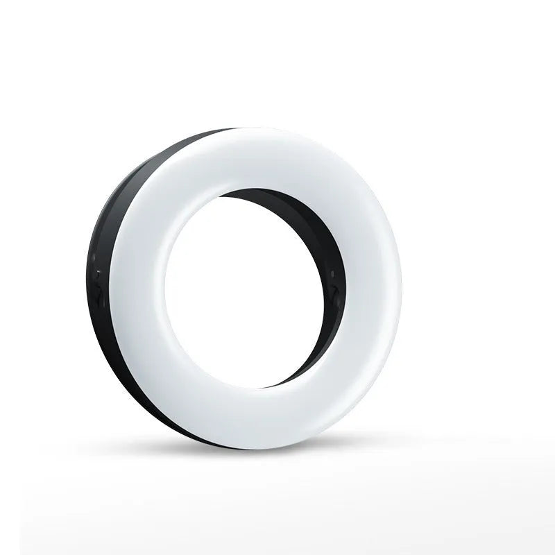 Compact black LED selfie ring light with USB cable for mobile phone photography.