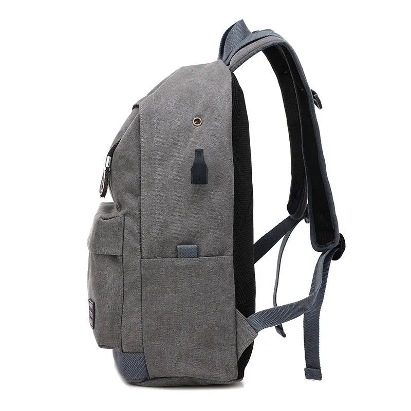 Canvas shoulder backpack with USB charging port in coffee colour showing computer pocket and main compartment