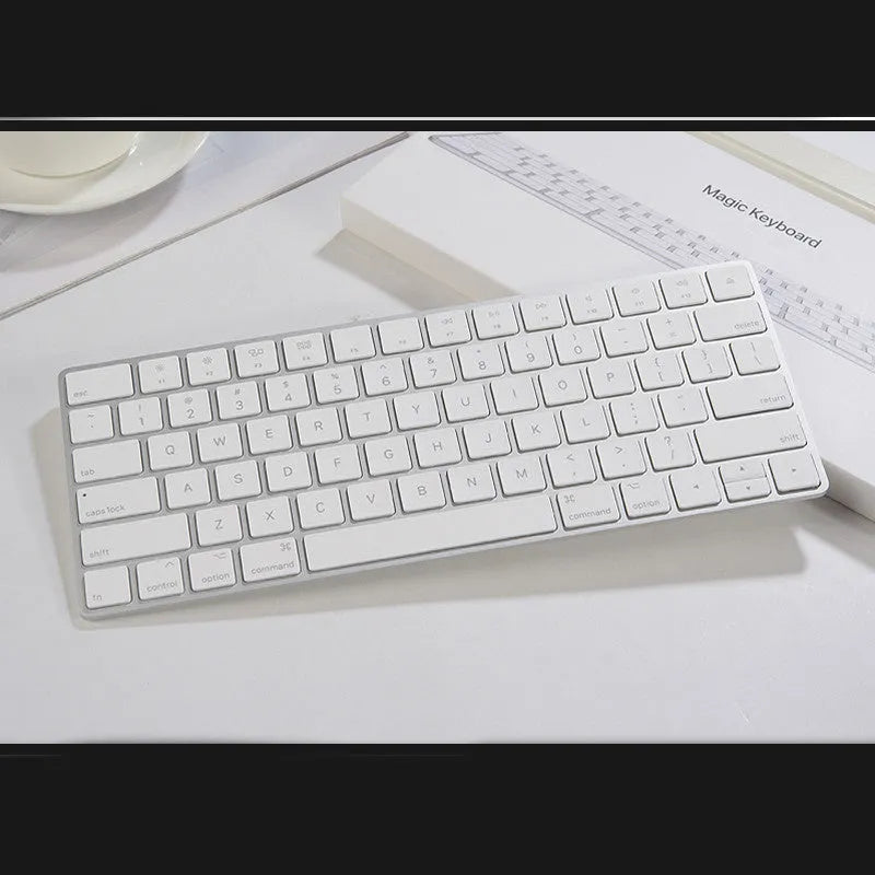 Apple white Bluetooth wireless keyboard with metal construction and multimedia keys