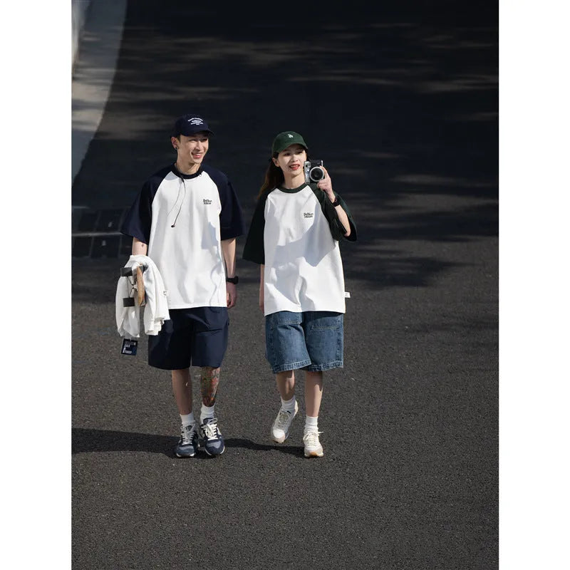 Man wearing a loose blue raglan sleeve casual t-shirt, Japanese style, thin polyester blend.