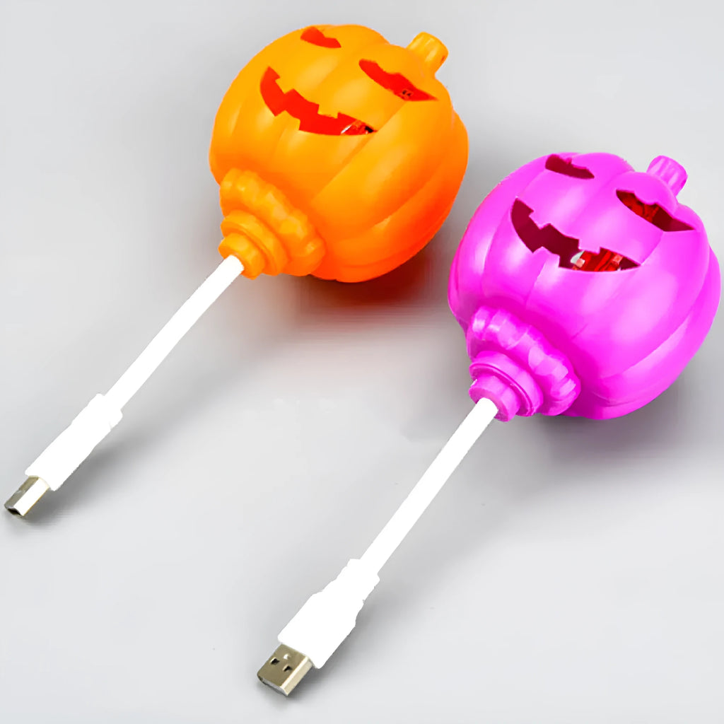Plastic pumpkin-shaped USB lamp emitting yellow or purple light, 8.3cm wide by 22cm tall