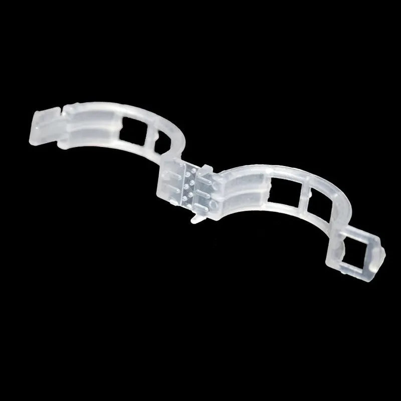 Assortment of 50 smooth plastic plant grafting clips for garden use on a white background.