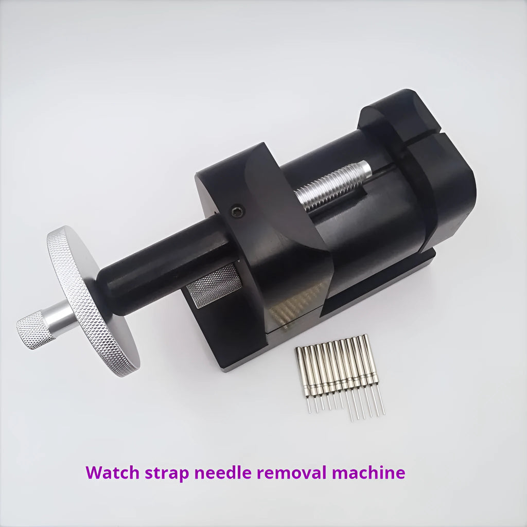 Steel alloy watch bracelet pin removal tool machine on a workshop bench.