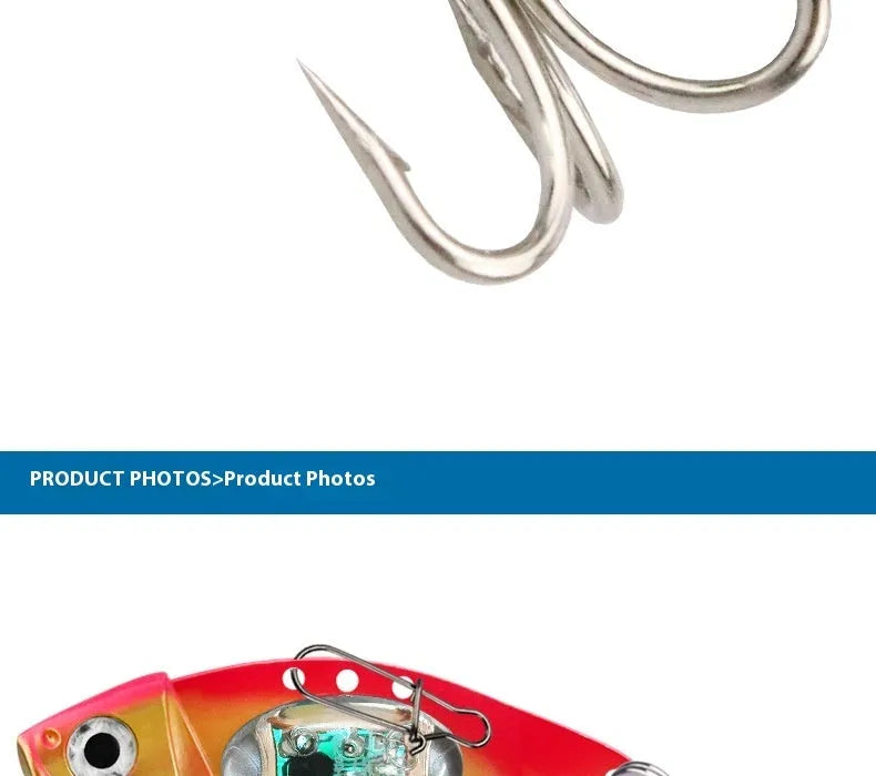 Electronic metal vib fishing lure with luminous elements in blue and red body colours
