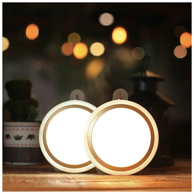 Compact round white motion sensor LED light with infrared sensor for wardrobes and corridors.