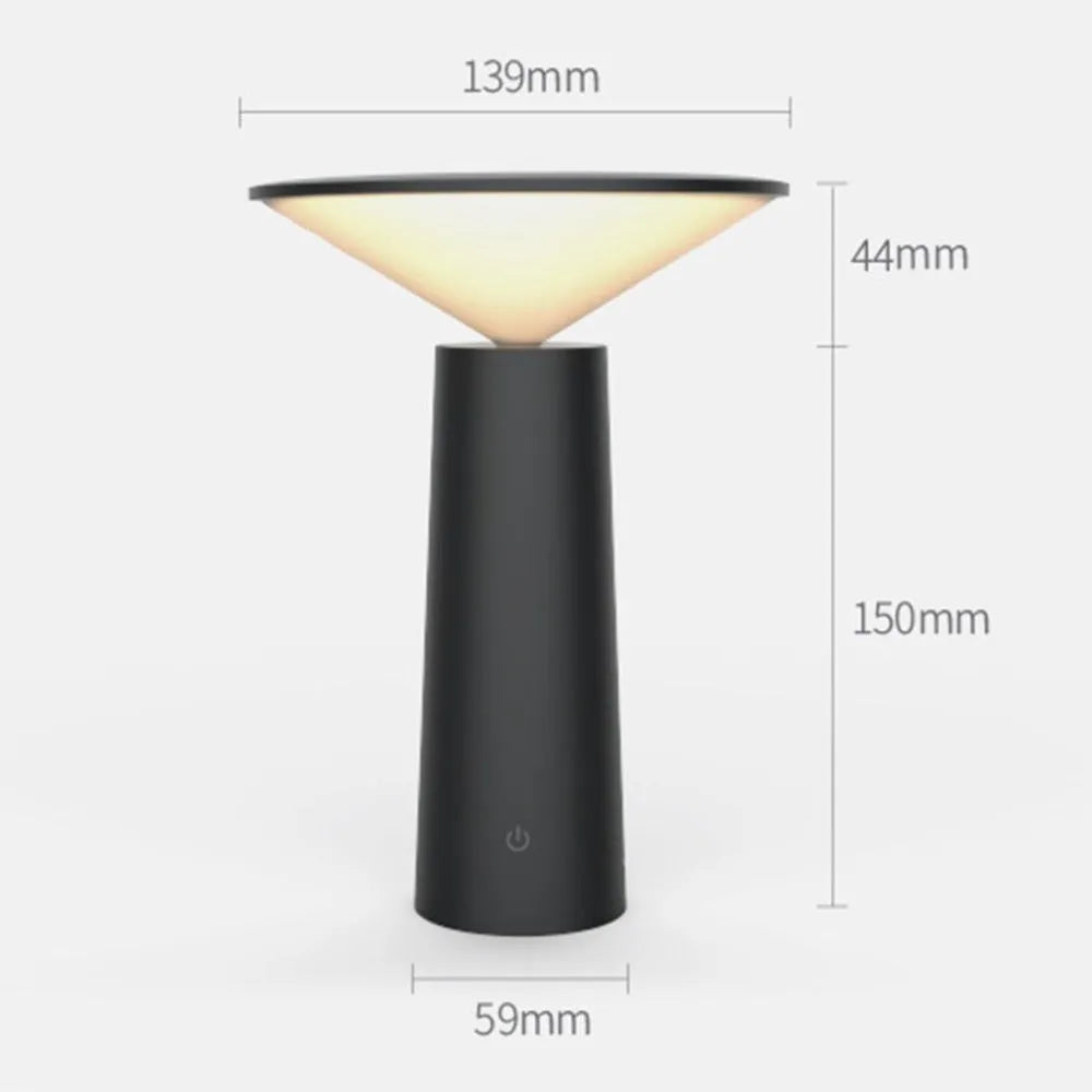 Black USB rechargeable LED desk lamp with touch sensor on a wooden desk, showing its adjustable lamp head.