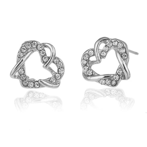 Gold colour alloy heart-shaped stud earrings on white background